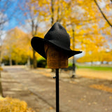 A Black Crochet Cotton packable Sun hat, styled and shaped into a Witches Hat for Autumn