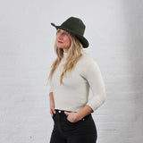 Leaf green Crochet Cotton Packable Sun Hat modeled on a women