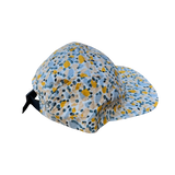 Back view of the 5 panel Flat Brim yellow and blue polka dot print with black adjustable strap clip 