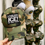 A Camo green Foam Trucker Cap with patch Abolish Ice for Pride and Rallies merch