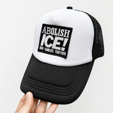 Black and White Foam Trucker Cap with a patch that reads: Abolish Ice! Keep Families Together