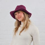 New Aster Purple Hat Color at North Ferry Hats, shown here on a White female model who loves sustainable fashion