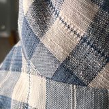 Close-up of blue and white checkered fabric of a Gingham Bucket hat hand-made in Ithaca NY by North Ferry Hats, a reversible waterproof Sun hat that fits all sizes