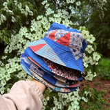 A Stack of Quilted Bucket Hats made from Upcycled Quilts and vintage fabrics.