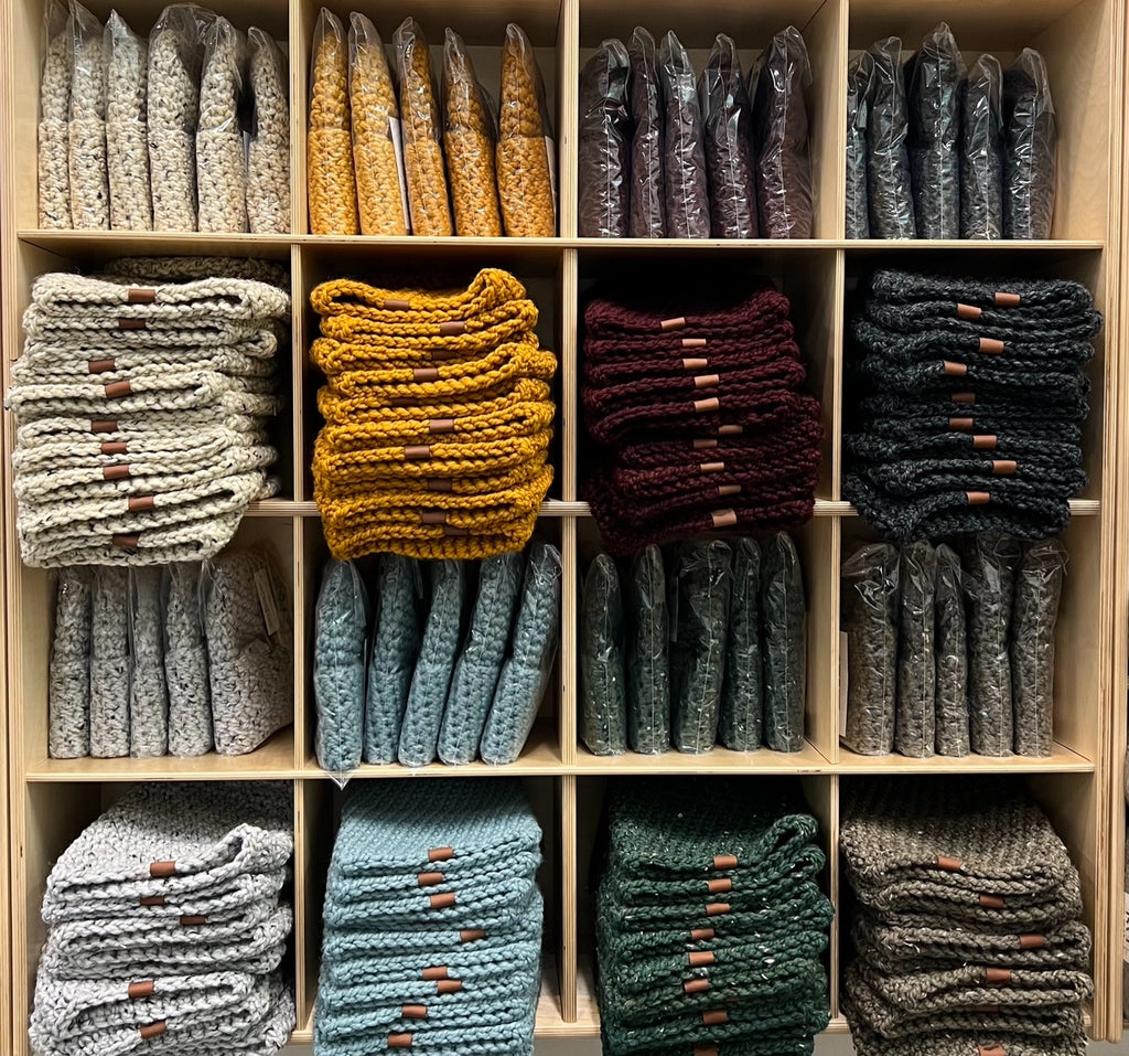 A Wall of Beanies at the Hat Shop in Ithaca NY featuring all of our color options Oatmeal Gold Plum Charcoal Brown Green Lite Blue
