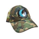 Camouflage cap with a patch that says 'I Poop on Racists' on a white background Cornell Lab of Ornithology Merch and Activism apparel Ithaca NY Ithaca is Gorges Cap