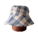 Blue and White gingham fabric bucket hats, hand-made in Ithaca NY using Upcycled Fabrics, Sustainable Woman Owned Brands that makes packable Sun hats bucket hats and beach hats