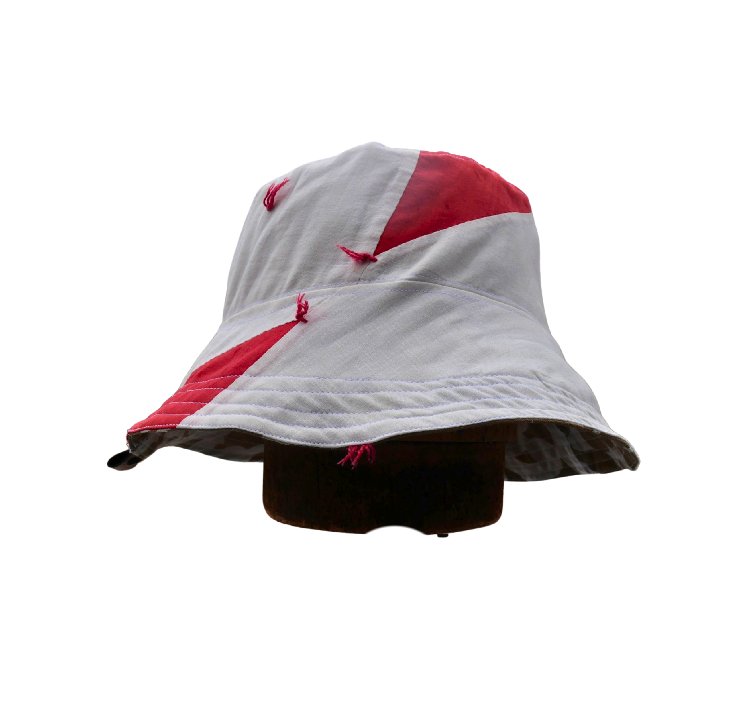 Sewing setup in a wood tiny house overlooking snowy woods scene. Sewing Bucket Hats in February for a sustainable hat company, available in spring reversible waterproof bucket hats and PACKABLE Sun hats made in the finger lakes