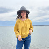 A Crochet Cotton Packable SUn Hat from North Ferry Hats can be worn in all seasons, packs for travel, and fits all sizes, from kids to adults