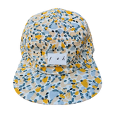 Front View of yellow and blue snapback with foh tag in white 